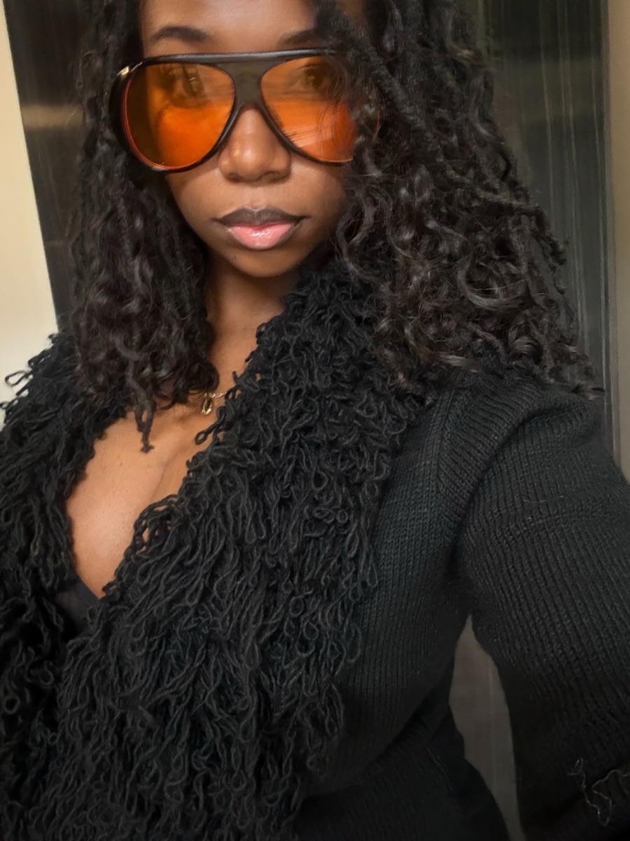 Founder Emily Prince wearing Miracle Knots in Burmese Curl, 12 inch, mixed in with her Locs